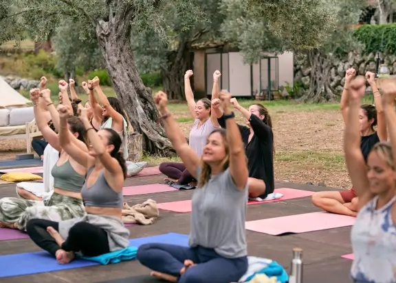 Students engaging in daily yoga and meditation poses at Adishesh Yoga School