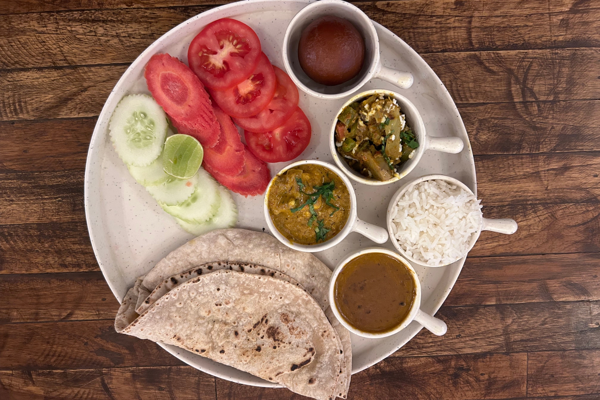 Simple sattvic meal arrangement in peaceful dining space at Adishesh Yoga