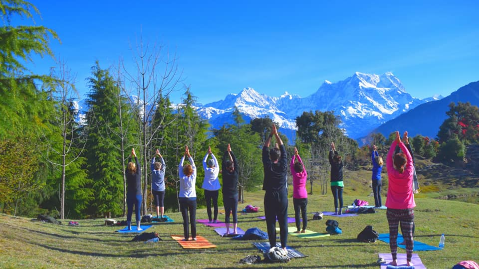 Yoga retreat participants trekking to Deoria Tal in Uttarakhand