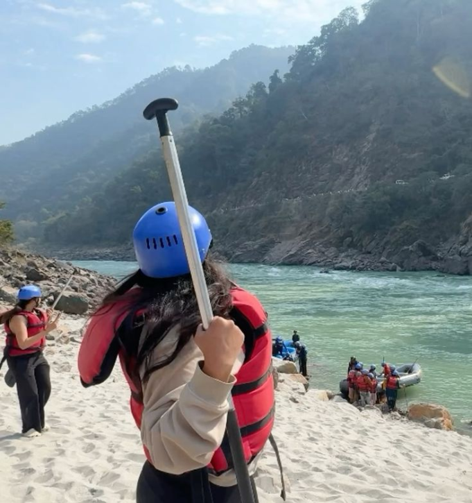 Group enjoying thrilling river rafting in Rishikesh on Ganga