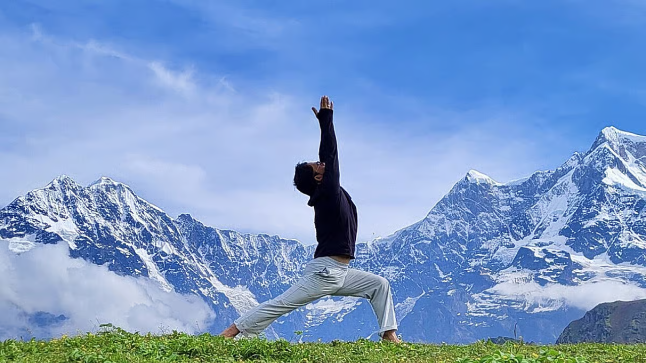 First-time yoga retreat participant journaling in nature during free time at a Rishikesh retreat