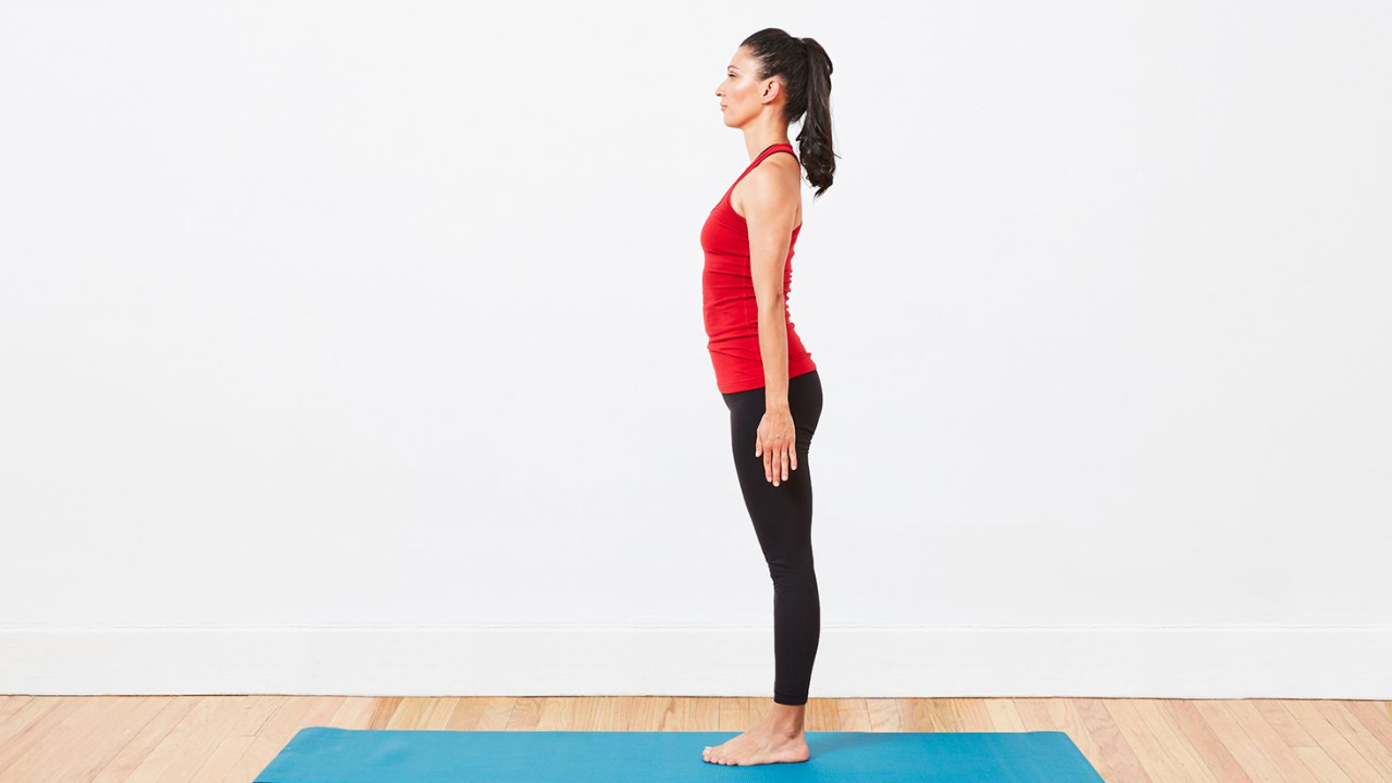 Beginner practicing Mountain Pose Tadasana in Hatha Yoga for proper alignment