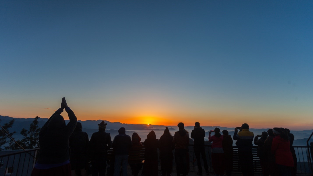 Kunjapuri Temple Rishikesh sunrise view with golden light over the Himalayan peaks and Ganges valley below