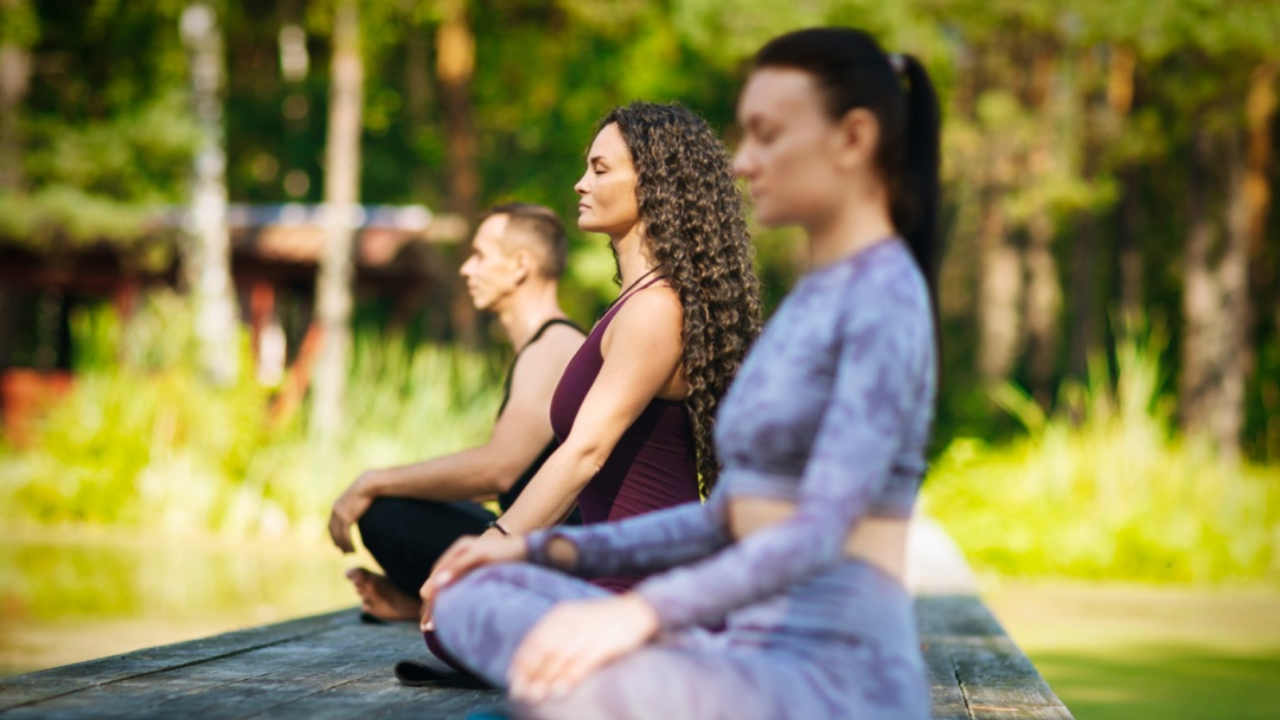 Person doing morning pranayama breathing exercises for weight loss