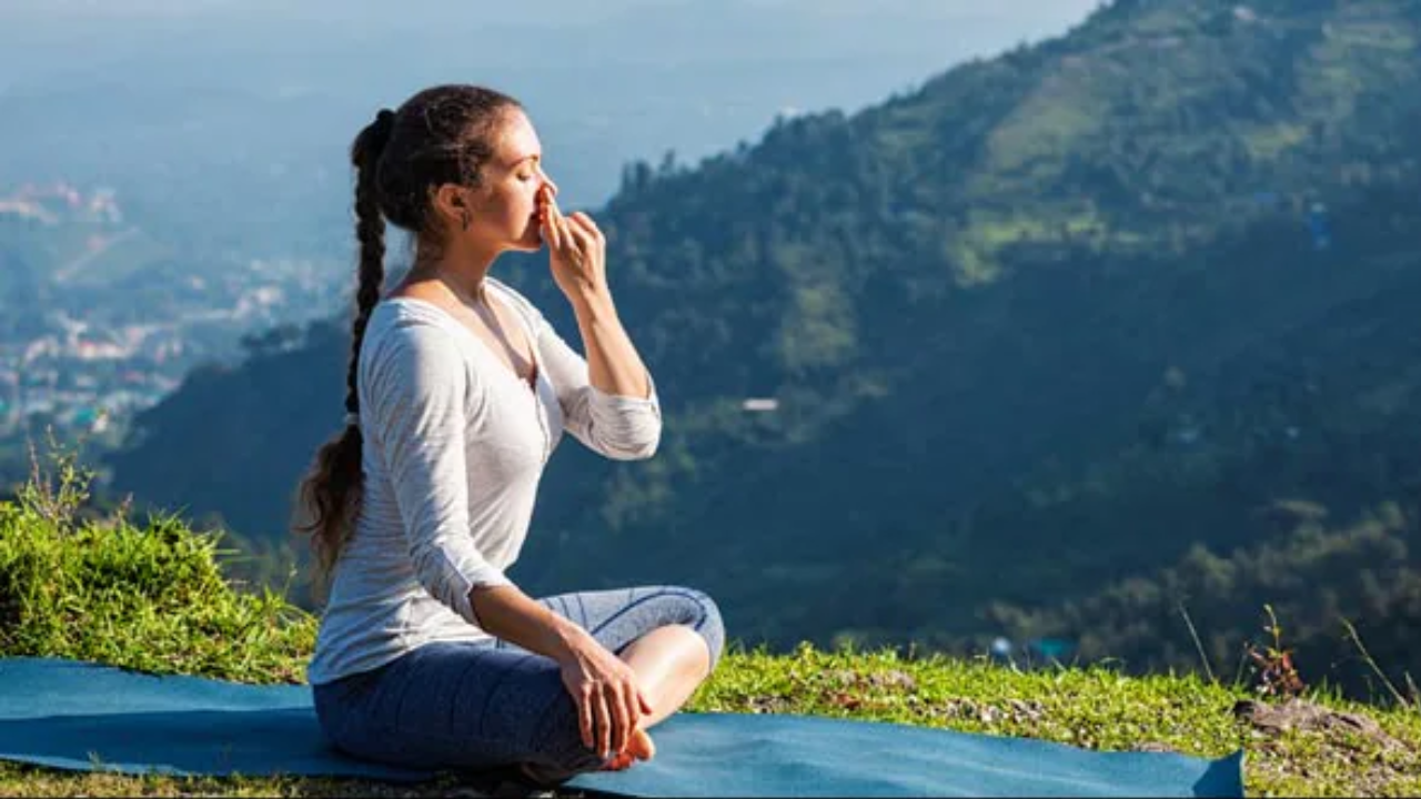 Woman practicing kapalbhati and bhastrika pranayama for weight loss
