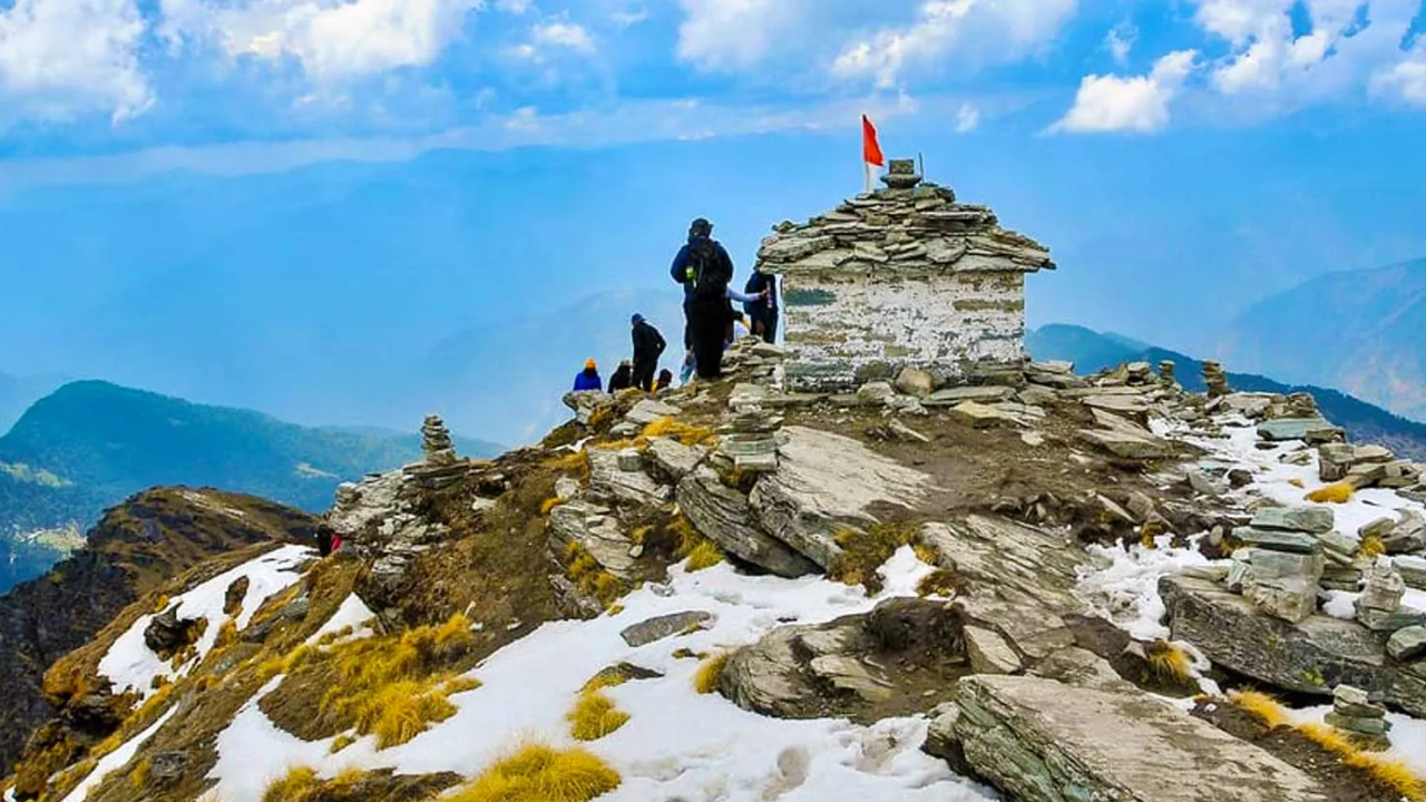 Yogis trekking misty Himalayan paths near Rishikesh waterfalls for nature yoga