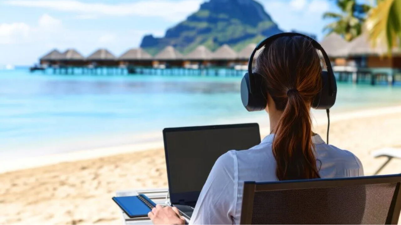 Solo traveler sitting with laptop researching and comparing yoga retreat options online