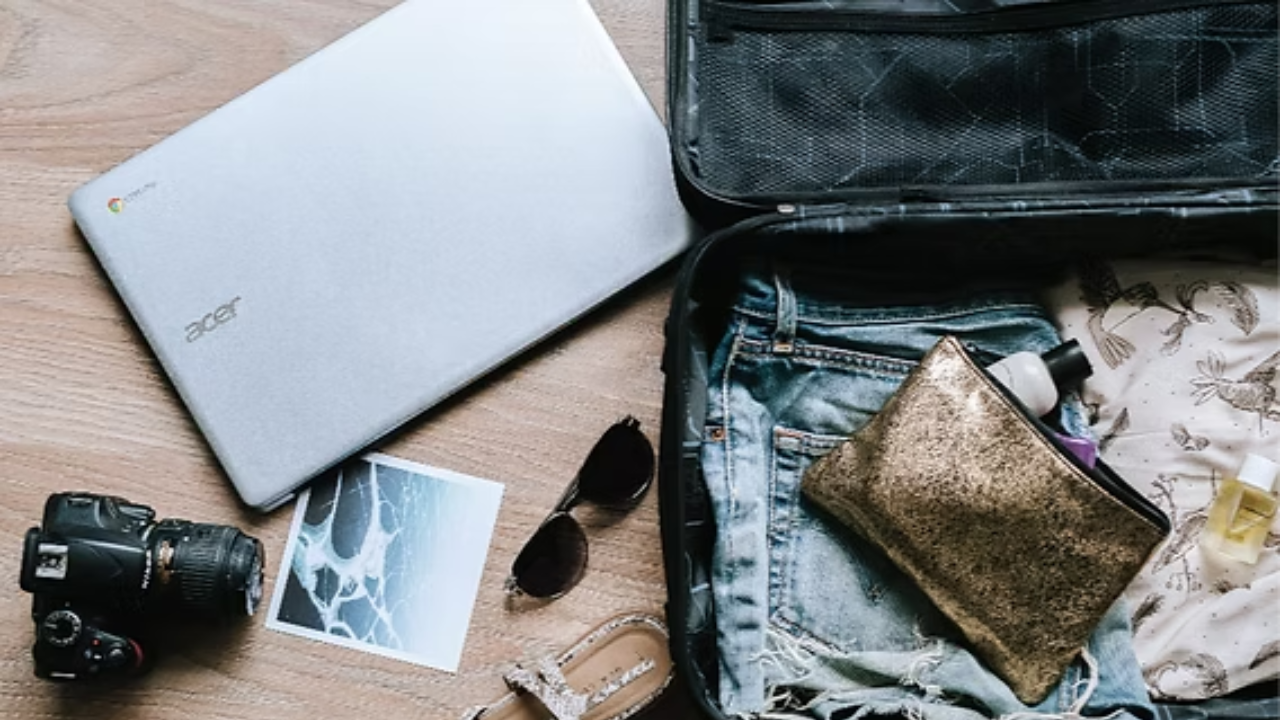 Yoga retreat packing essentials laid out flat including yoga mat journal water bottle and comfortable clothes for solo travel