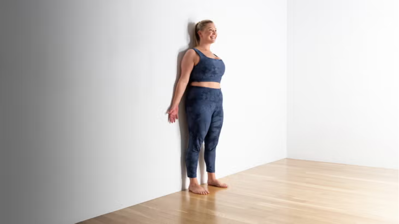 Wall assisted Tadasana beginner alignment mountain pose yoga