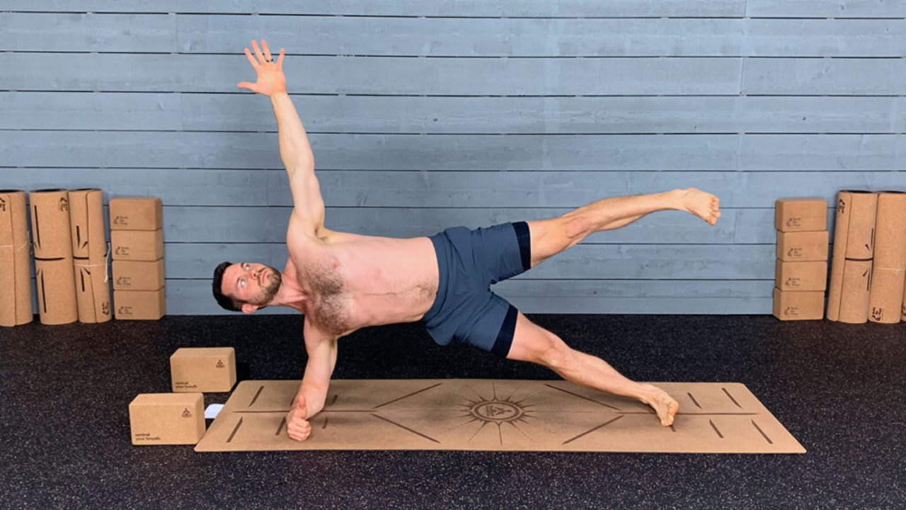 Person practicing yoga for men's weight loss