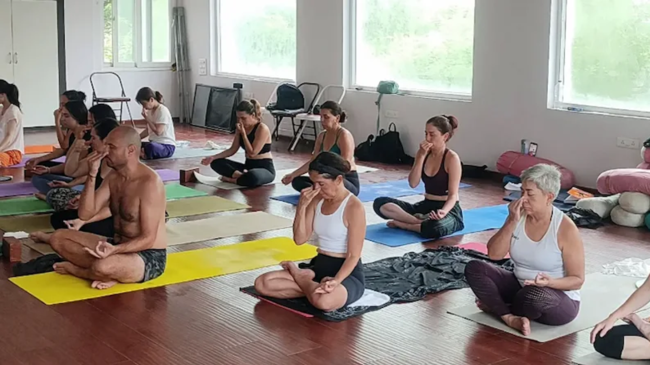 Advanced yoga students doing 14 day deep immersion retreat practice in Rishikesh surrounded by nature