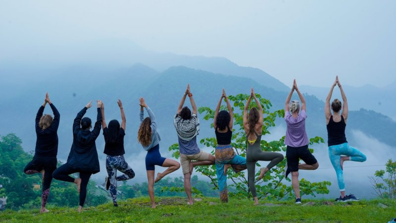 Peaceful yoga retreat nestled in mountain nature setting with open-air yoga shala surrounded by trees