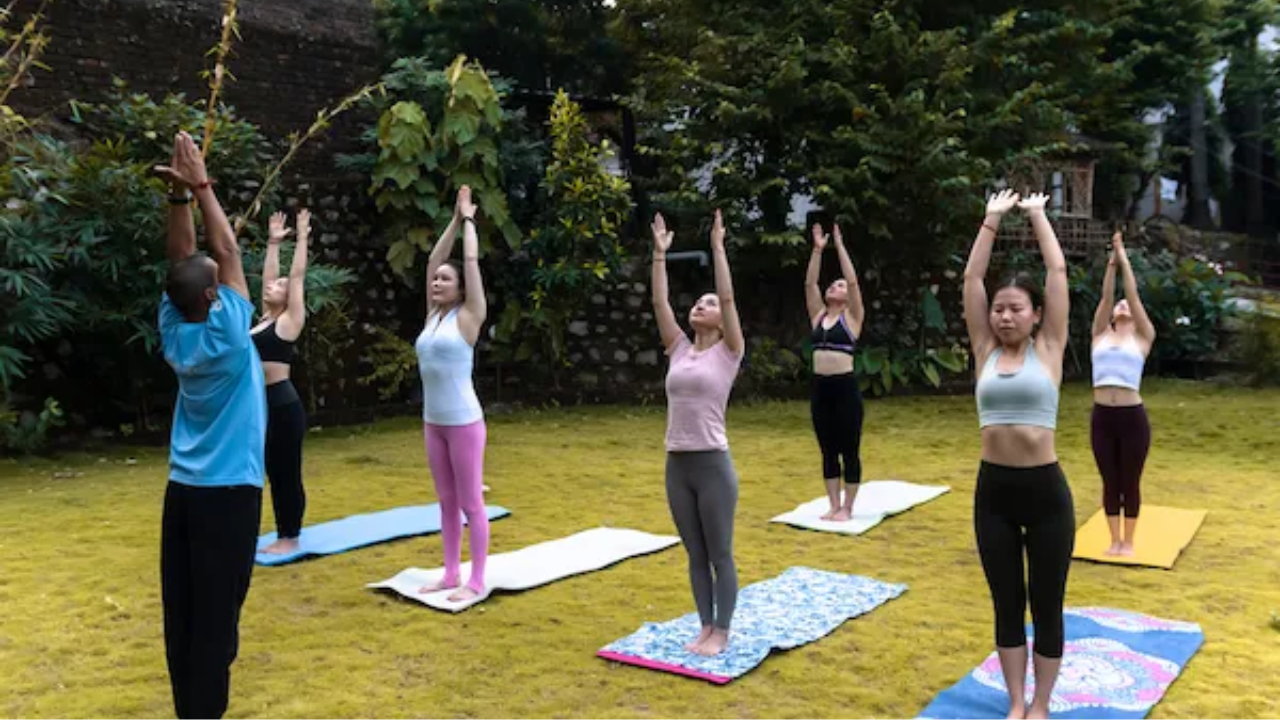 Yoga retreat teacher welcoming new guests during orientation session on first day explaining schedule and retreat guidelines
